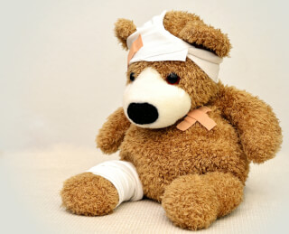 brown-and-white-bear-plush-toy