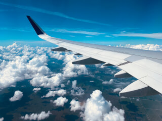 dhn-plane-fly-over-clouds