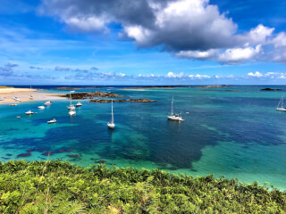 high-angle-photography-of-beach-with-sailing-boats-under