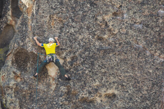 man-doing-outdoor-rock-climbing