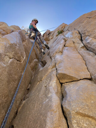 Denise rappelling down an Ortega Falls route